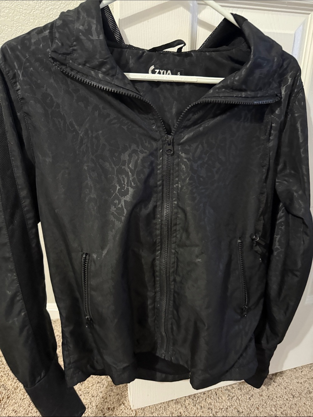 ZYIA Black Hooded Windbreaker with Subtle Jacquard Pattern